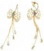 Boucles d'oreilles dorées n_ud blanc strass couleur